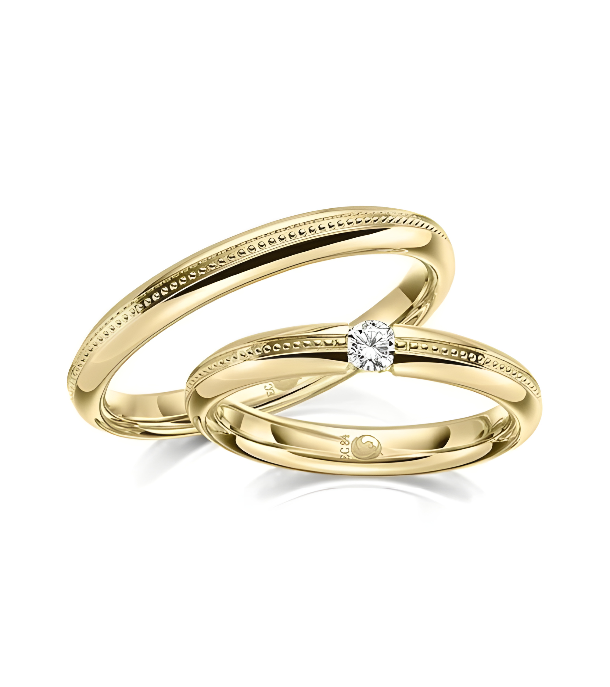 Pareja de alianzas de boda con diseño especial en oro con un diamante - Alianzas de boda - 


